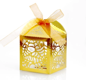 Golden laser-cut spider web candy box with matching organza ribbon for Halloween parties