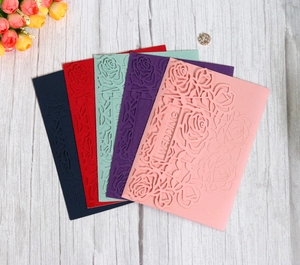 Laser-cut rose flower wedding invitation covers in multiple elegant colors and patterns
