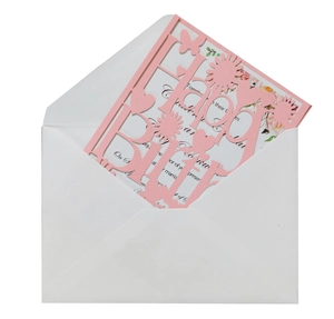 Detail of laser-cut Happy Birthday card with pink floral pattern and white envelope