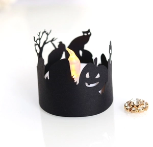 Detail of Halloween silhouette lampshade featuring pumpkin and cat with LED candle light