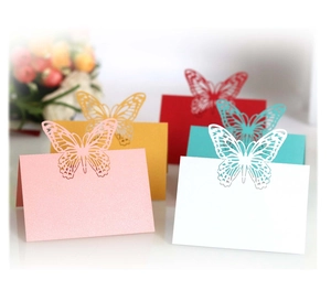 Laser cut butterfly place cards in multiple colors made of elegant pearlescent paper