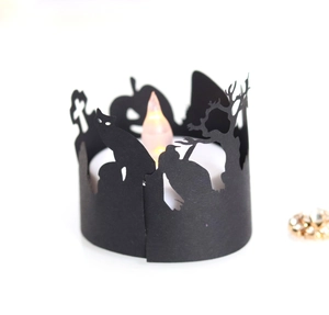 Detailed laser-cut Halloween candle cover featuring witch, cat and pumpkin silhouettes
