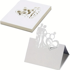 Laser cut Mr & Mrs white wedding place cards with bride and groom silhouette design