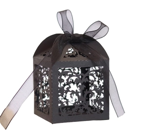 Elegant black laser-cut candy box with vine patterns and a matching organza ribbon bow