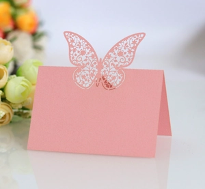 Elegant laser-cut pink butterfly place cards for romantic wedding table seating decor