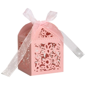 Pink laser-cut wedding favor box with hollow floral pattern and elegant satin ribbon