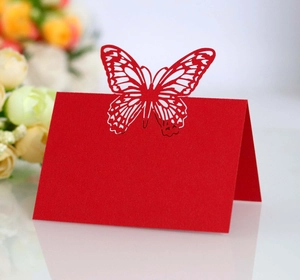 Detailed laser-cut butterfly wedding place card in bright red pearlescent paper