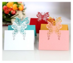 Hollow butterfly laser cut wedding place cards in pink white and assorted colors