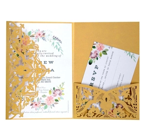 Detail of laser-cut gold lace floral cover with watercolor floral wedding invitations set