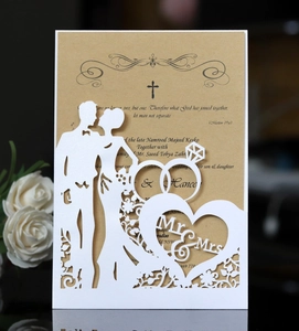 Detail of laser-cut Mr & Mrs wedding invitation with bride and groom silhouette and kraft insert