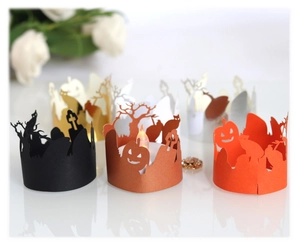 Laser cut Halloween paper candle wraps showing pumpkin, cat and witch silhouettes