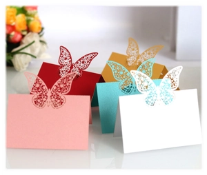 Laser-cut butterfly place cards in multiple colors for wedding table settings