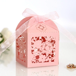 Pink laser-cut flower gift box with ribbon bow for wedding favors and chocolates