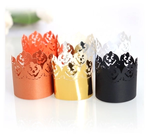 Laser-cut Halloween paper wraps with pumpkin patterns in assorted metallic colors