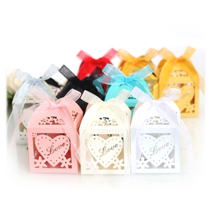 Laser-cut pink and multi-color paper candy boxes with Love heart design and ribbons