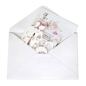 Laser-cut wedding invitation set with heart ring silhouette and floral Hebrew insert