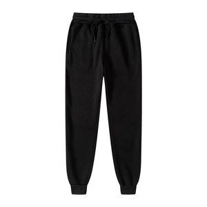 Detailed view of black athletic joggers featuring drawstring waist and ribbed cuffs