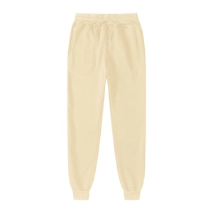 Detail of cream fleece joggers showing drawstring waistband and ribbed ankle cuffs