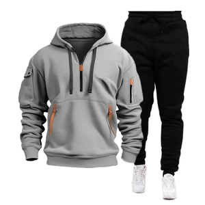 Men's two-piece sports tracksuit with grey half-zip hoodie and black drawstring joggers
