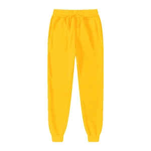 Detail of yellow joggers featuring elastic drawstring waist and ribbed cuffs for sports