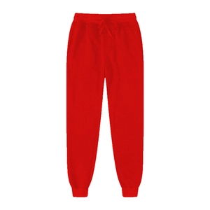 Detail view of red athletic sweatpants featuring elastic drawstring waist and ribbed cuffs
