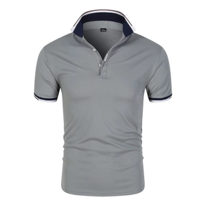 Detail of grey polo shirt with navy striped collar and classic woven label on the placket