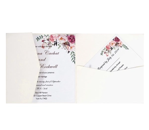 Detailed view of cream laser-cut pocket wedding invitation with floral watercolor cards