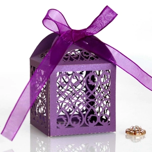 Detailed laser-cut purple gift box with floral patterns and a matching ribbon bow