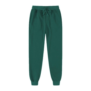 Flat lay of dark green fleece joggers with adjustable drawstring and ribbed cuffs