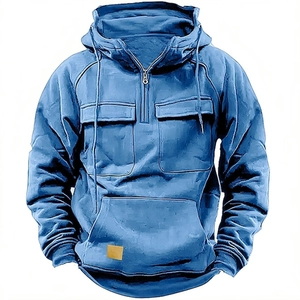 Detail of royal blue men's hoodie featuring front chest pockets and square logo patch