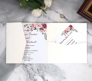 Detail of elegant ivory pocket-fold wedding invitation with watercolor floral design
