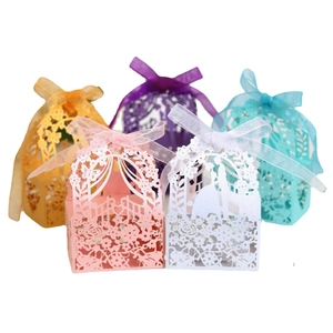 Laser cut wedding favor boxes with elegant ribbons in five different pastel colors