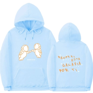 Detail of light blue hoodie featuring Spanish astronaut prints on front and back