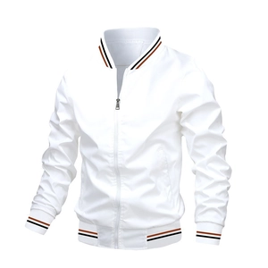 Detail of white men's jacket featuring black and orange striped ribbed cuffs and collar