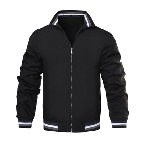 Detail of classic black bomber jacket featuring striped rib-knit collar and metal zipper
