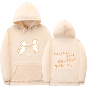 Detail of beige hoodie showing couple astronaut print and Spanish typography text