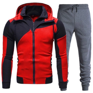 Detail view of men's two-piece tracksuit with red black zip hoodie and grey joggers