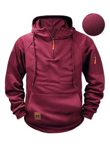 Sweat à capuche bordeaux pour homme avec quart de fermeture éclair et zoom sur le tissu