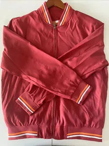 Detail showing the ribbed collar with orange and white stripes on a red bomber jacket