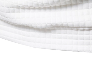 Close-up of white quilted waffle texture and fabric detail on men's casual hoodie