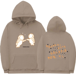 Detail of khaki hoodie showing astronaut graphic print and Spanish typography details