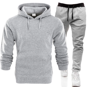 Detail of grey hooded sweatshirt and joggers set with drawstring waist and ribbed cuffs
