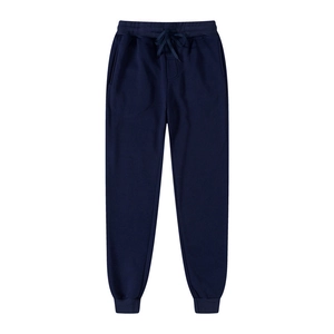 Detail of dark blue sports joggers featuring adjustable drawstring waist and elastic cuffs