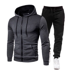 Detail of men's hooded tracksuit featuring gray honeycomb gradient pattern and zipper