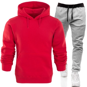 Red hooded sweatshirt with kangaroo pocket and grey jogger pants sportswear set