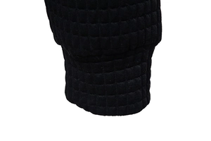 Close-up of black hoodie ribbed cuff with quilted waffle pattern texture and fine knit detail