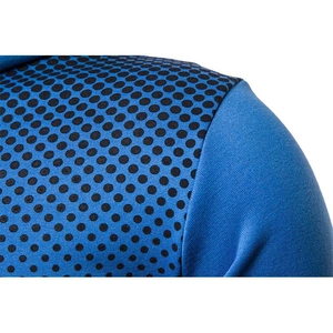 Close-up detail of blue men's hoodie featuring stylish black polka dot pattern on shoulder
