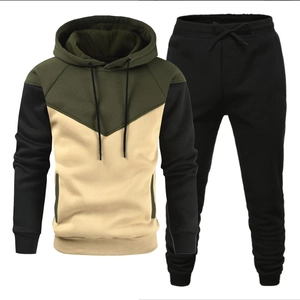 Men's casual tracksuit set featuring a tri-color patchwork hoodie and black joggers