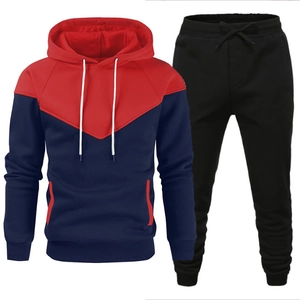Men's stylish casual sports tracksuit with red and navy blue hooded sweatshirt and black joggers