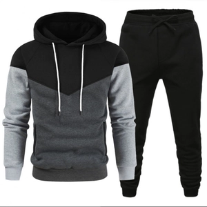 Men's two-piece tracksuit with hoodie and joggers in black and grey color-block design